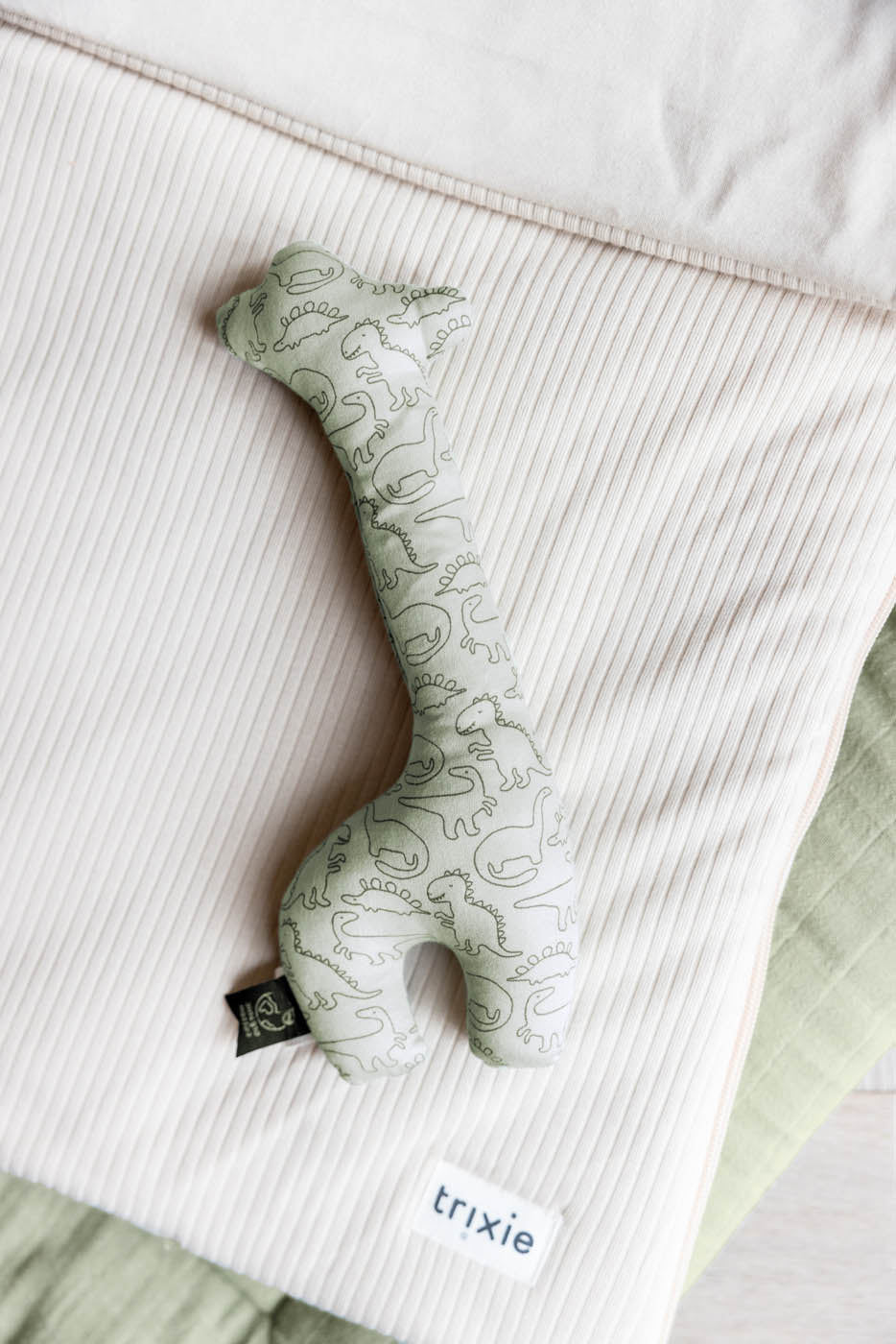 Trixie rattle Mr. Dino